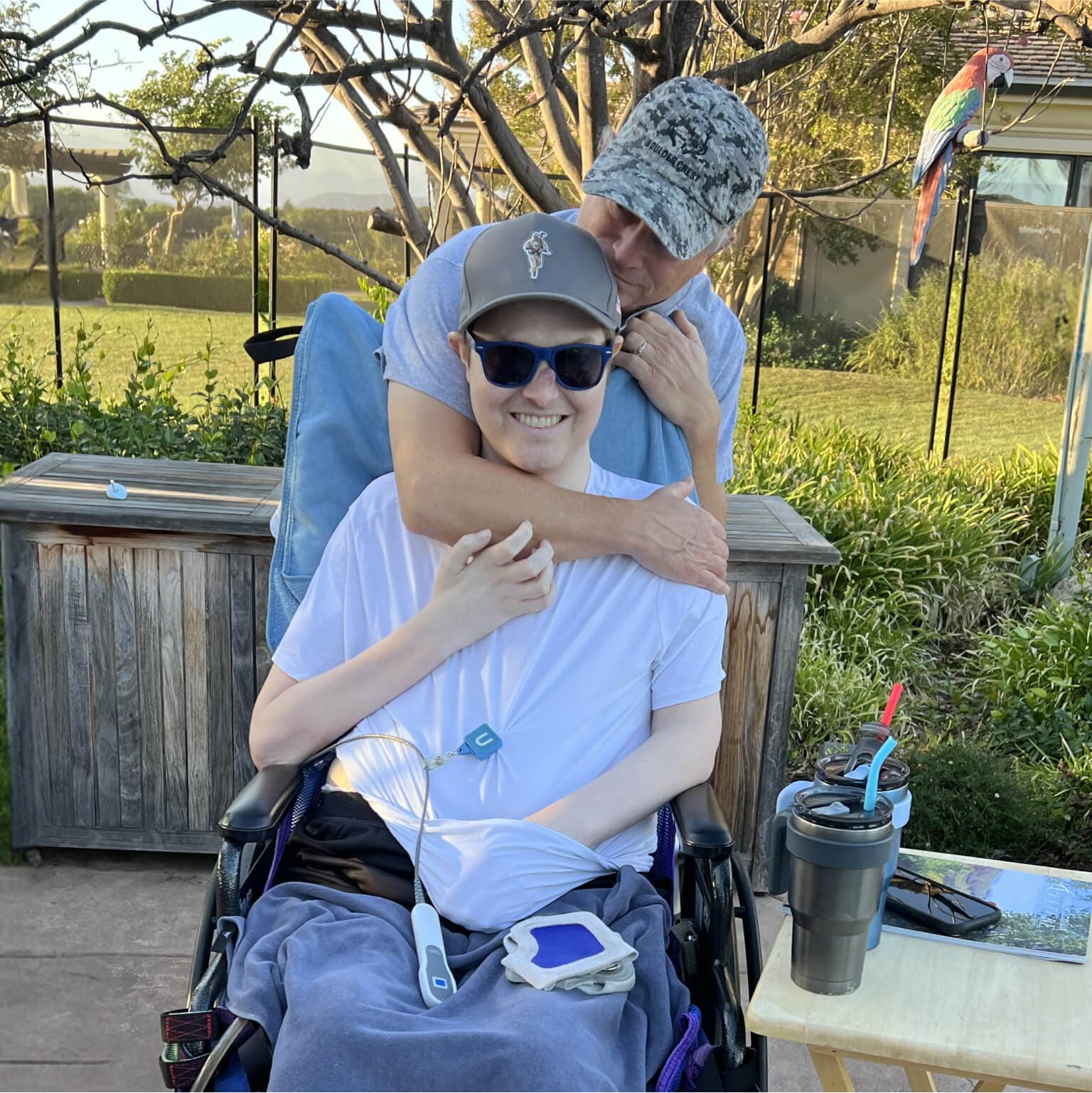 Mac with his father in their yard.