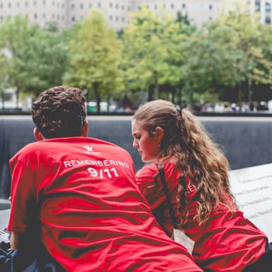 Two students reflecting at the 9/11 memorial.
Source: 240927-Watts GSF-85